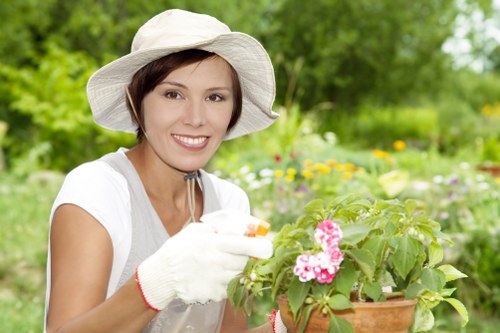 Gardener at work in a residential garden preparing tools